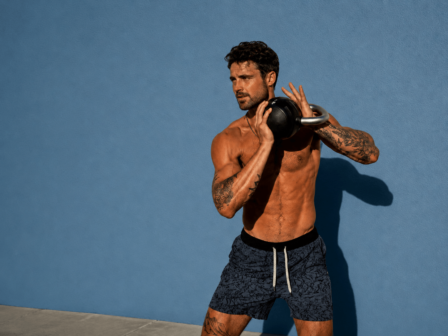 Athletic man training with a kettlebell