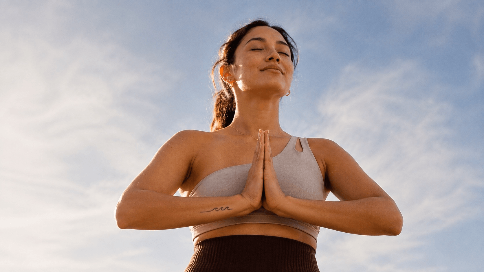 Woman at sunrise after a weight-loss milestone